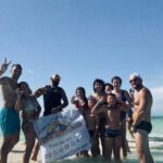 Tourists enjoying a luxury yacht excursion to Ras Mohammed National Park and White Island in Sharm El Sheikh with snorkeling, diving, coral reefs, tropical fish, and crystal-clear Red Sea water. STAR KHATTABYCH TOURS