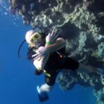 Tourists enjoying a luxury yacht excursion to Ras Mohammed National Park and White Island in Sharm El Sheikh with snorkeling, diving, coral reefs, tropical fish, and crystal-clear Red Sea water. STAR KHATTABYCH TOURS